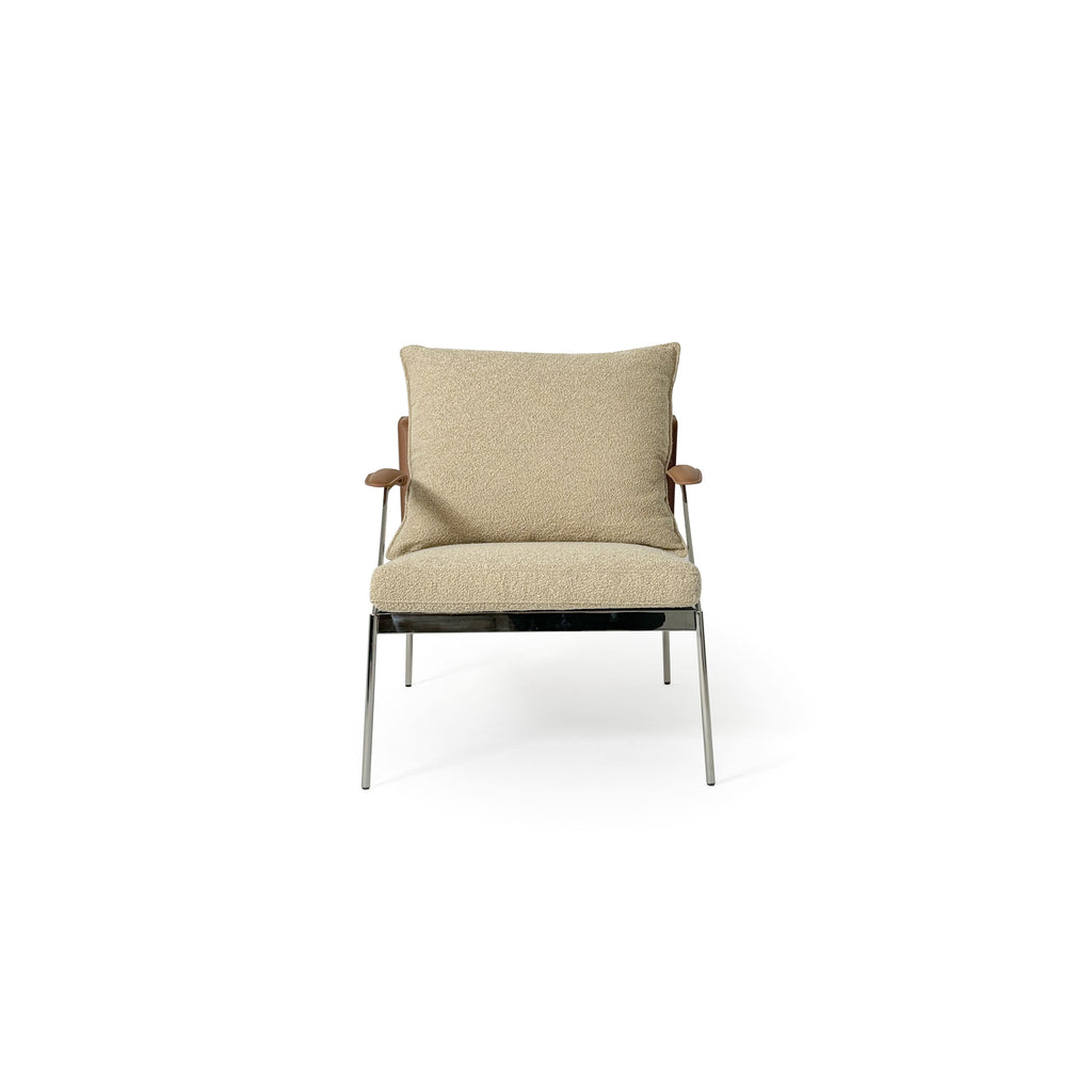 Armchair with beige boucle fabric upholstery, wooden armrests, and chrome metal legs. Features a cushioned seat and backrest, stitched seams, and a sleek, modern silhouette. Designed for seated comfort in living spaces. Category: Furniture > Chairs > Armchairs