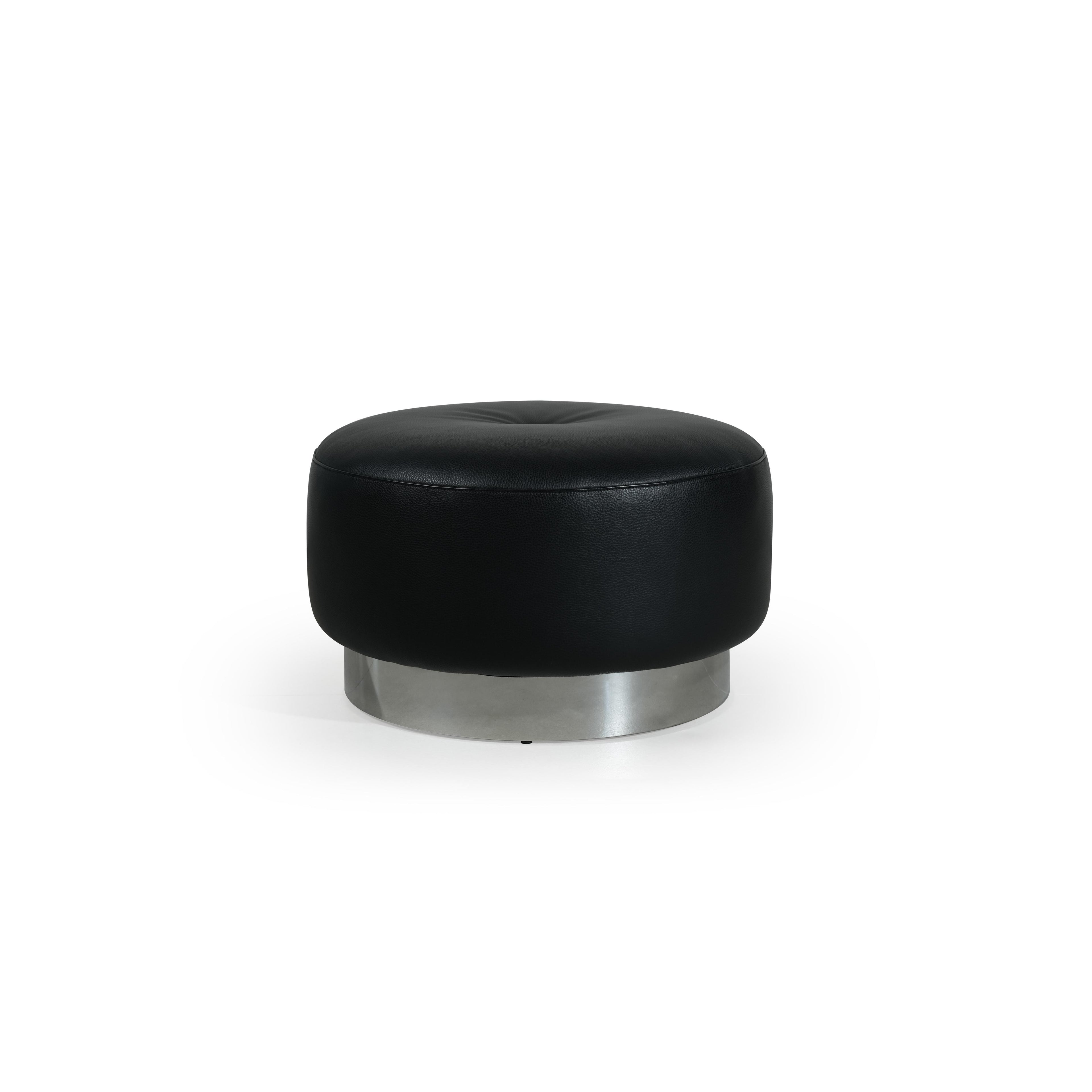Round ottoman with black leather-like upholstery and a circular metallic base. Features tufted center cushion and smooth, rounded edges. Designed for seating or footrest use. Category: Furniture > Ottomans