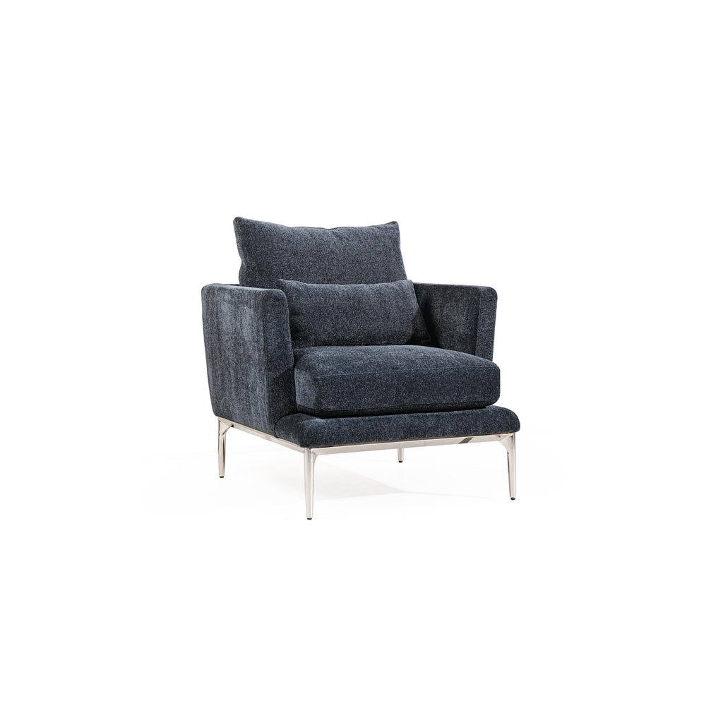 Armchair with dark gray textured fabric upholstery, featuring a rectangular backrest, padded seat, and matching armrests supported by four slender metallic legs. Intended for seated comfort in living spaces. Category: furniture/armchairs
