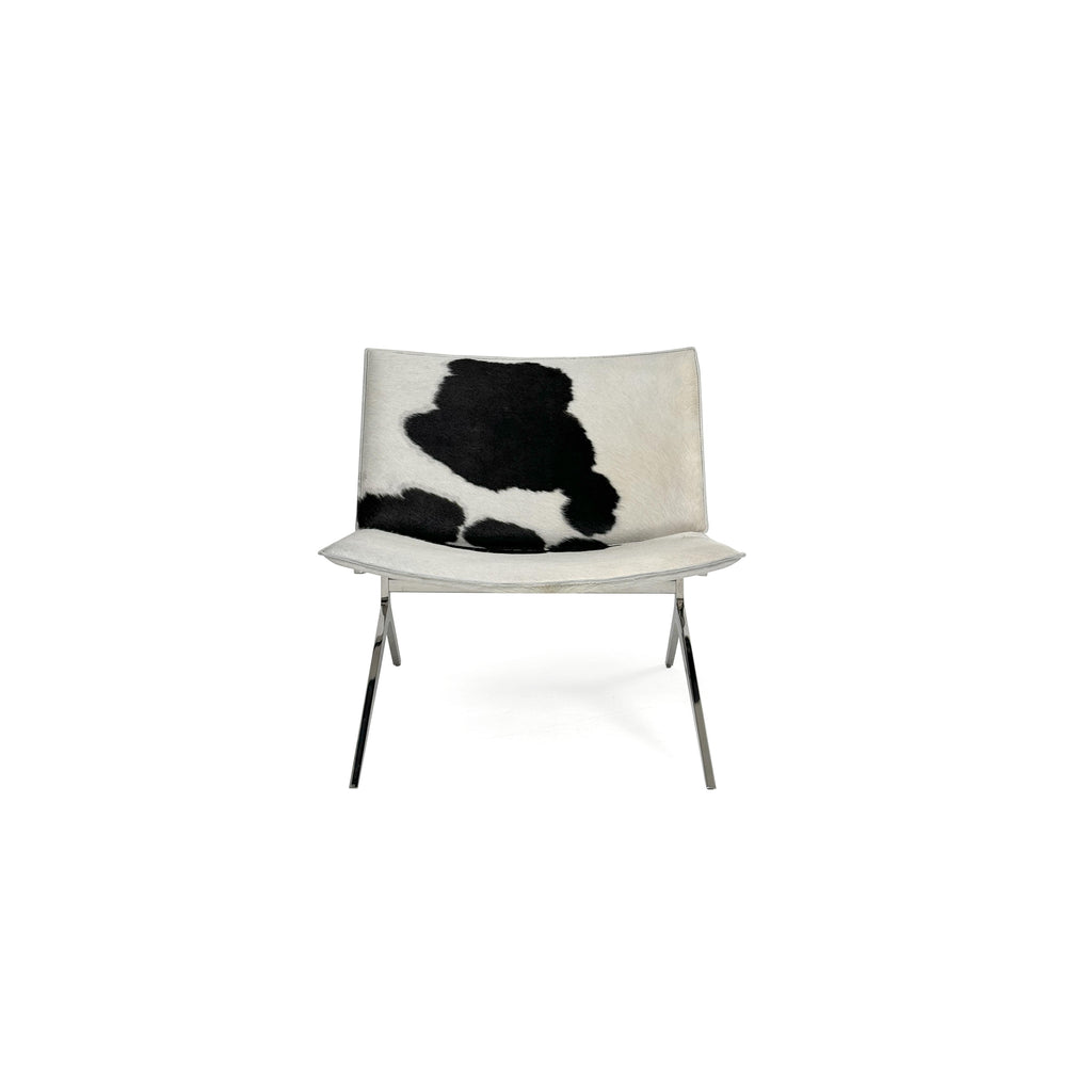 This is a modern lounge chair with a black and white cowhide upholstery on the seat and backrest, supported by a sleek, metallic X-shaped base. The chair has no arms or cushions, and its structure is minimalist. Intended for casual seating, it features a flat, continuous surface for comfort. Category: Furniture > Chairs > Lounge Chairs