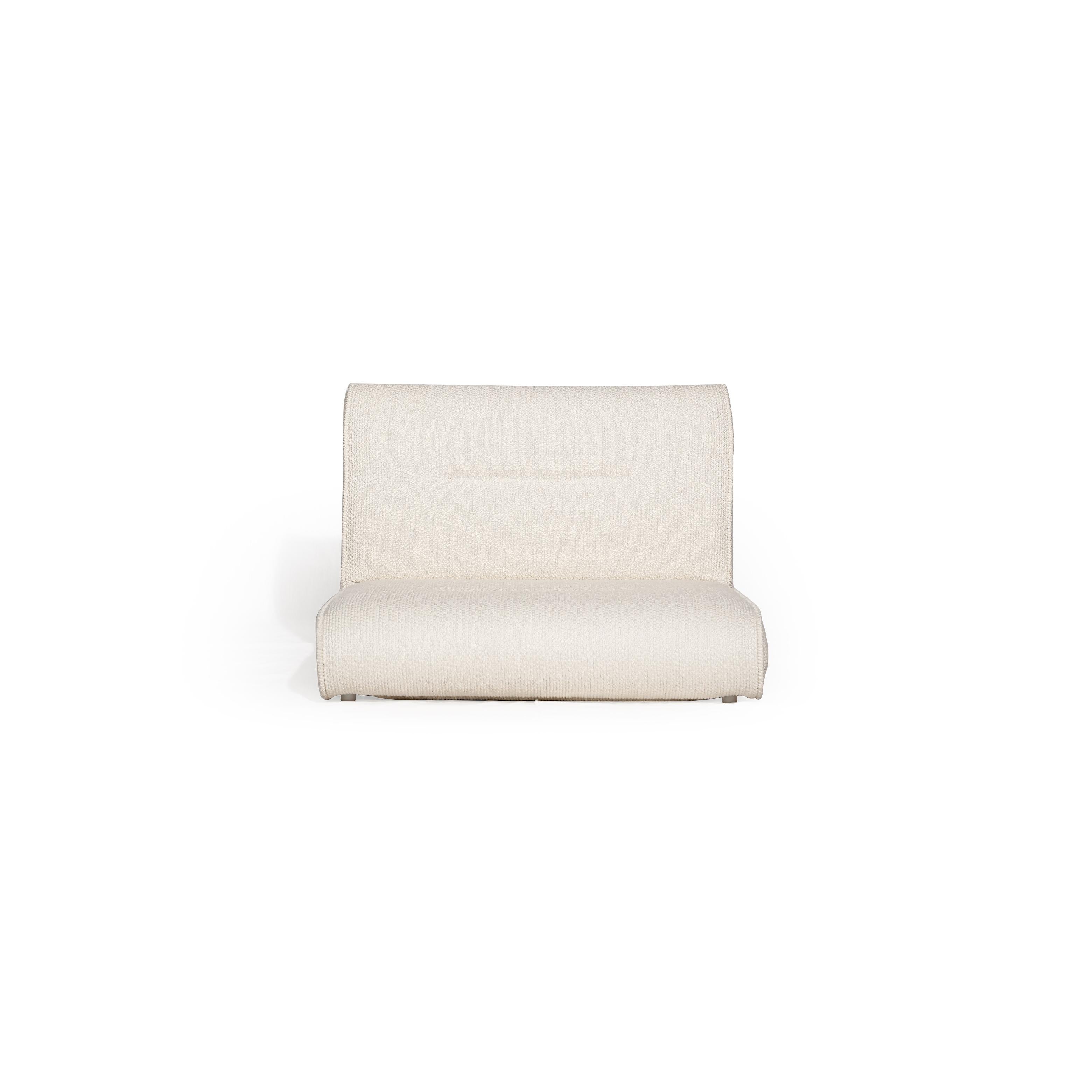 This is a single-seater upholstered chair with a low-profile, angular form. It features a continuous backrest and seat cushion, covered in a textured, off-white boucle fabric. No visible legs or frame structure. Intended for casual seating. Category: furniture/chairs/single-seater