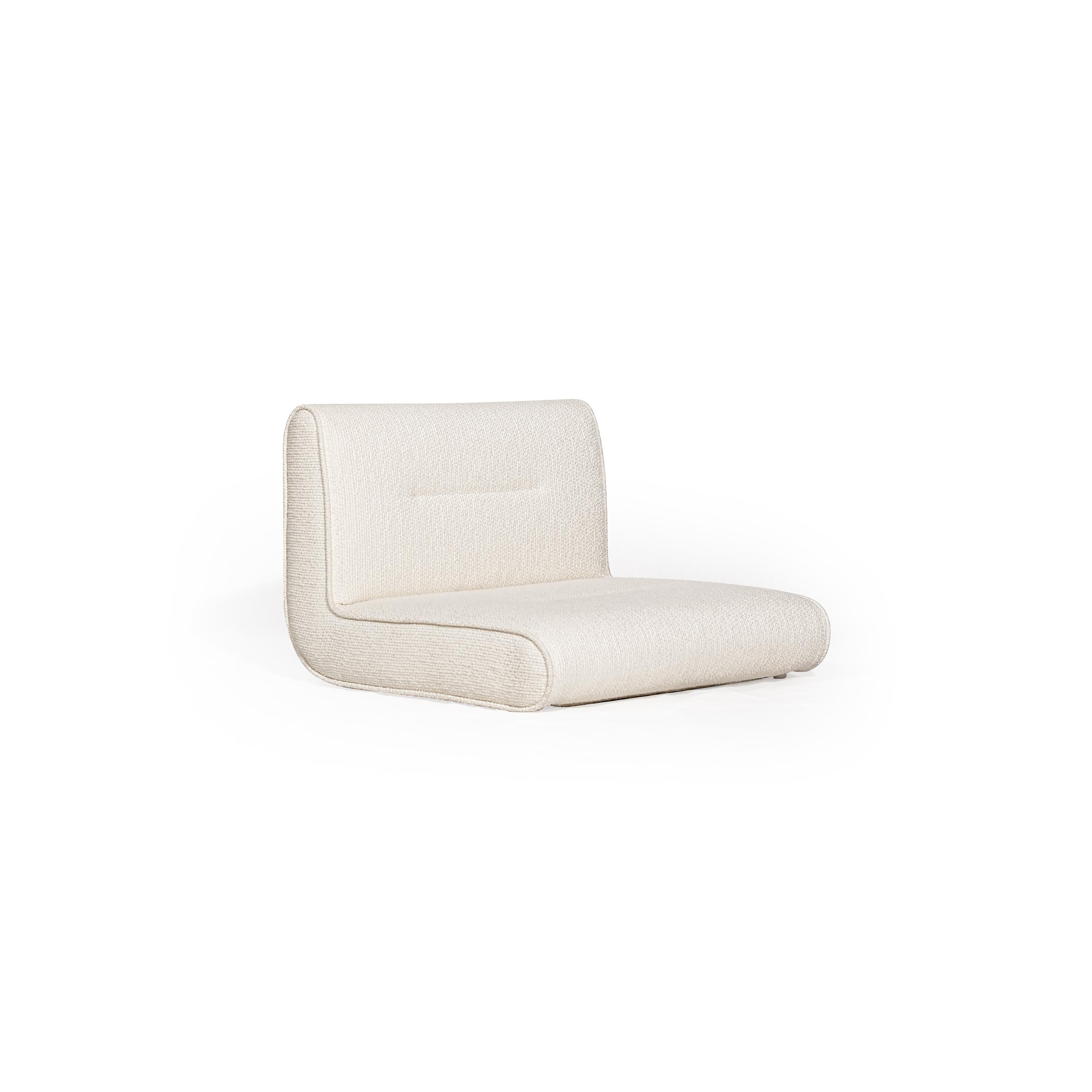 This is a single-seater upholstered chair with a low-profile, angular form. It features a continuous backrest and seat cushion, covered in a textured, off-white boucle fabric. No visible legs or frame structure. Intended for casual seating. Category: furniture/chairs/single-seater