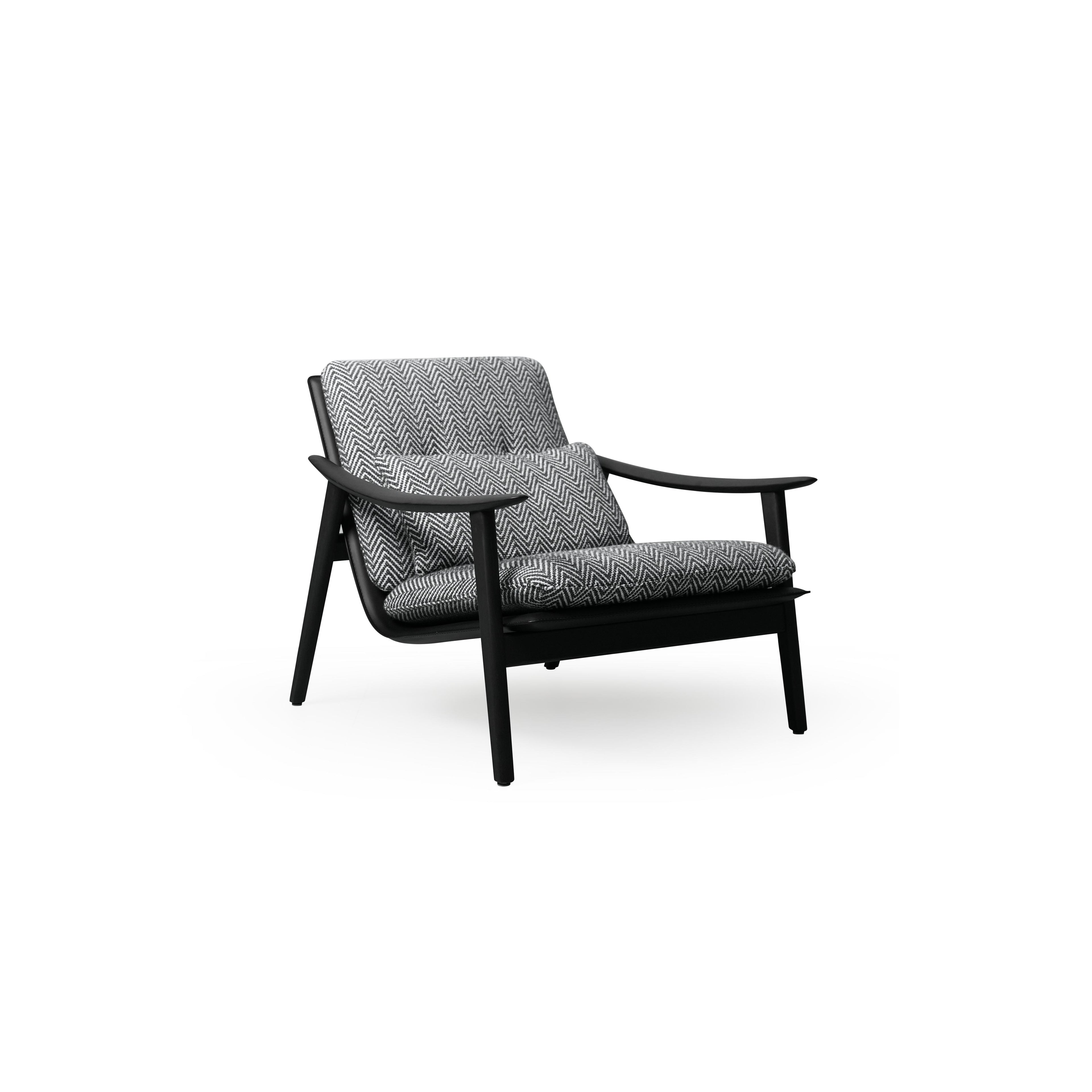 A single armchair with a black frame and herringbone-patterned fabric upholstery. It features curved arms, four angled legs, a cushioned seat and backrest, and visible stitching. Designed for seating, it has a modern silhouette with a low-profile base. Category: Furniture > Chairs > Armchairs