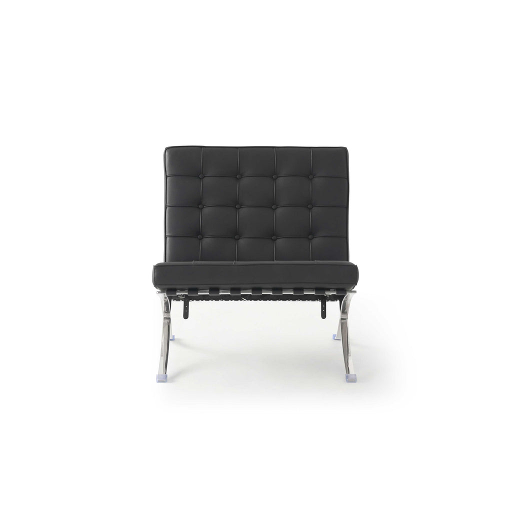 Black upholstered armless chair with tufted backrest and seat, supported by chrome metal legs with plastic feet; features stitched seams and visible frame connectors; designed for seating; Category: Furniture > Chairs > Armless Chairs