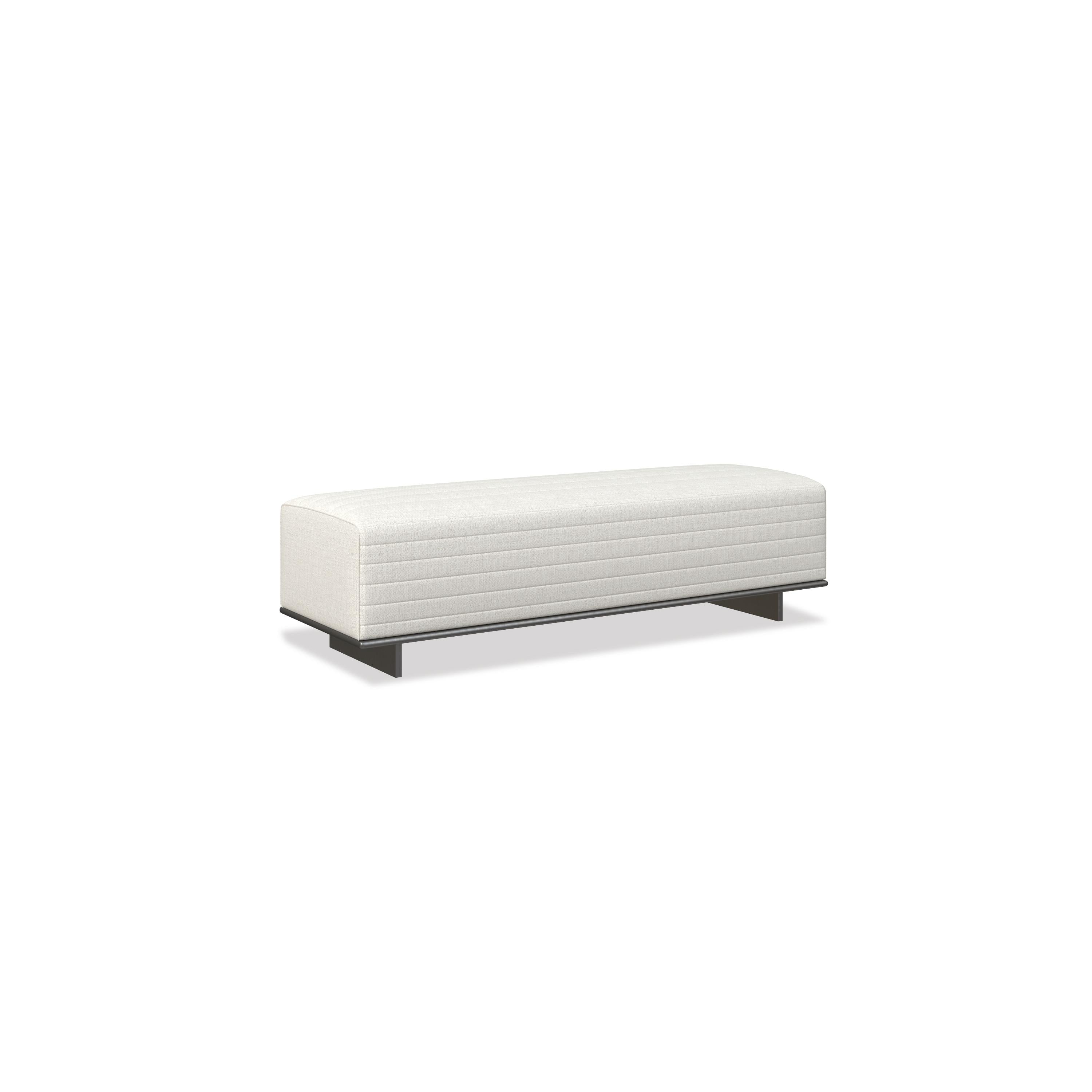 A rectangular upholstered bench with a white fabric surface featuring horizontal stitching. It rests on two dark metal legs. Designed for seating, it has a low profile and no arms or backrest. Category: Furniture > Seating > Bench