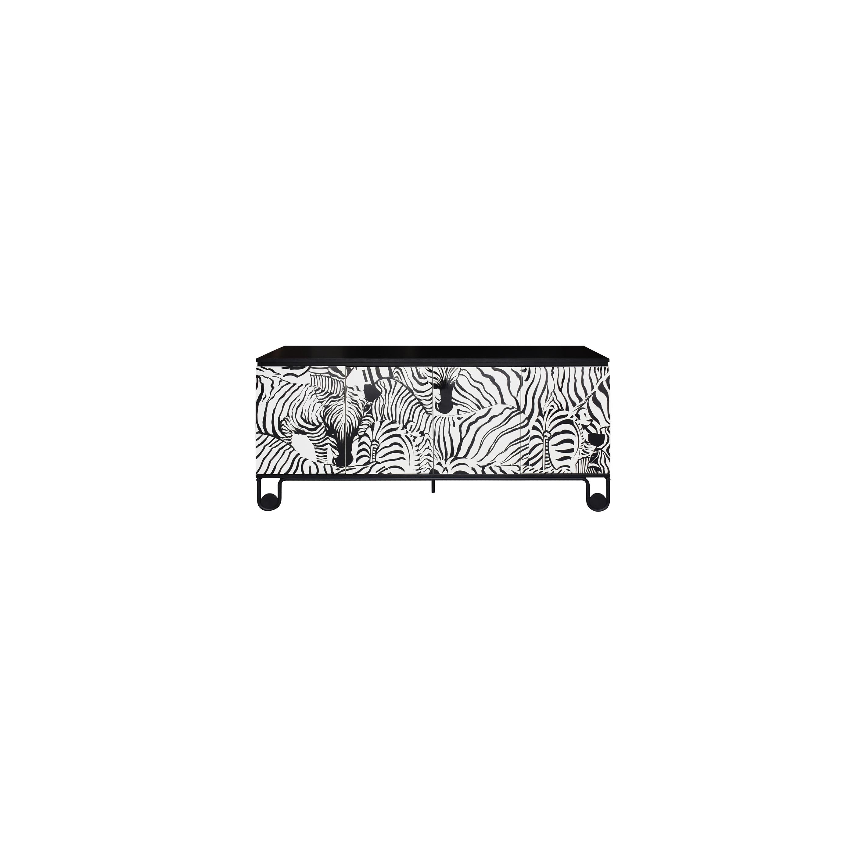 A low-profile sideboard with three doors featuring bold black and white zebra stripe patterns, supported by four rounded black legs and a flat black top surface; intended for storage and display in living or dining areas. Category: furniture > sideboards