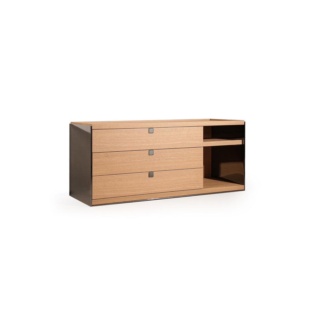 Modern dresser with three wooden drawers and one open shelf on the right side, featuring dark metal sides and small square handles; crafted from wood with visible grain, designed for storage in bedrooms or living areas. Category: furniture/dressers