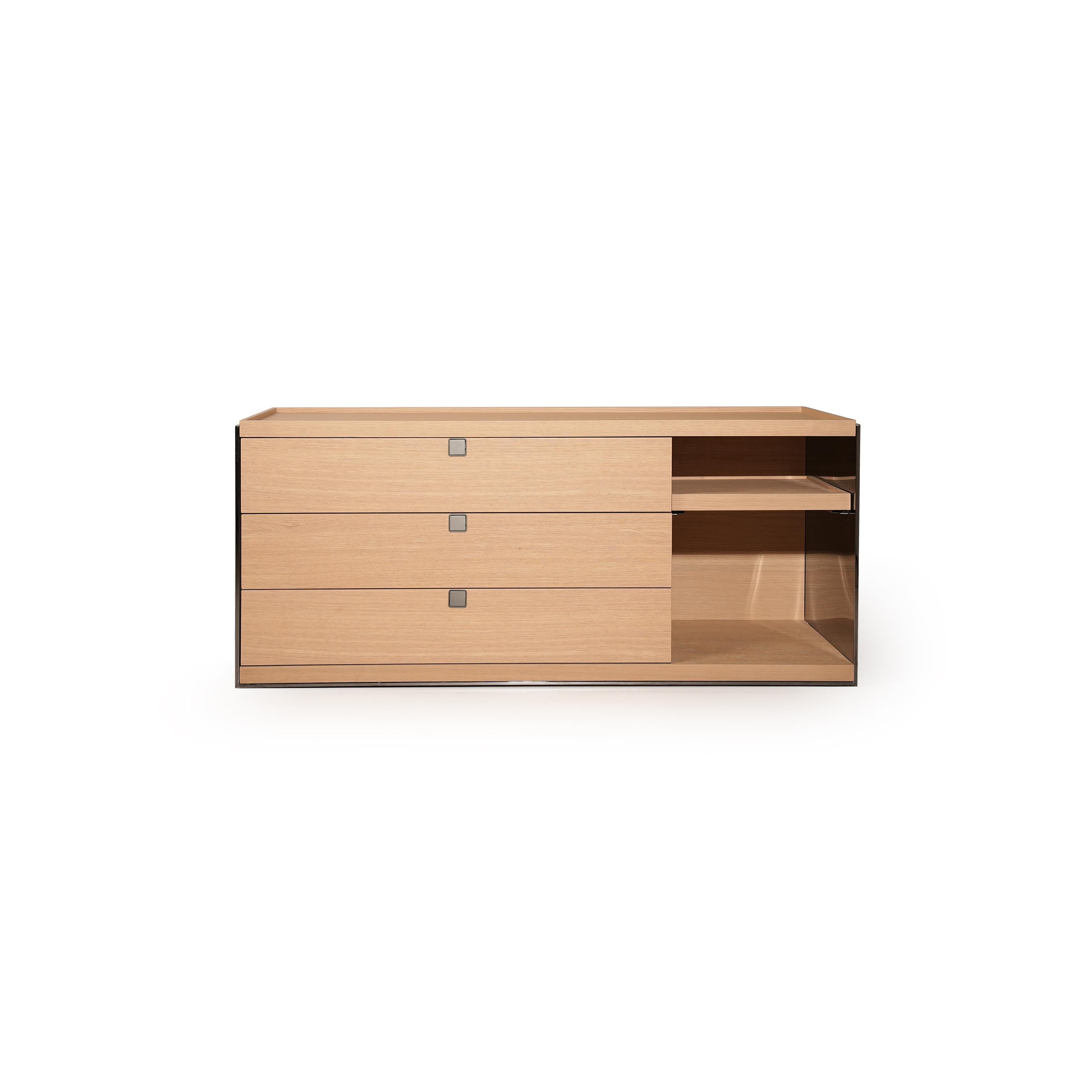 Modern dresser with three wooden drawers and one open shelf on the right side, featuring dark metal sides and small square handles; crafted from wood with visible grain, designed for storage in bedrooms or living areas. Category: furniture/dressers