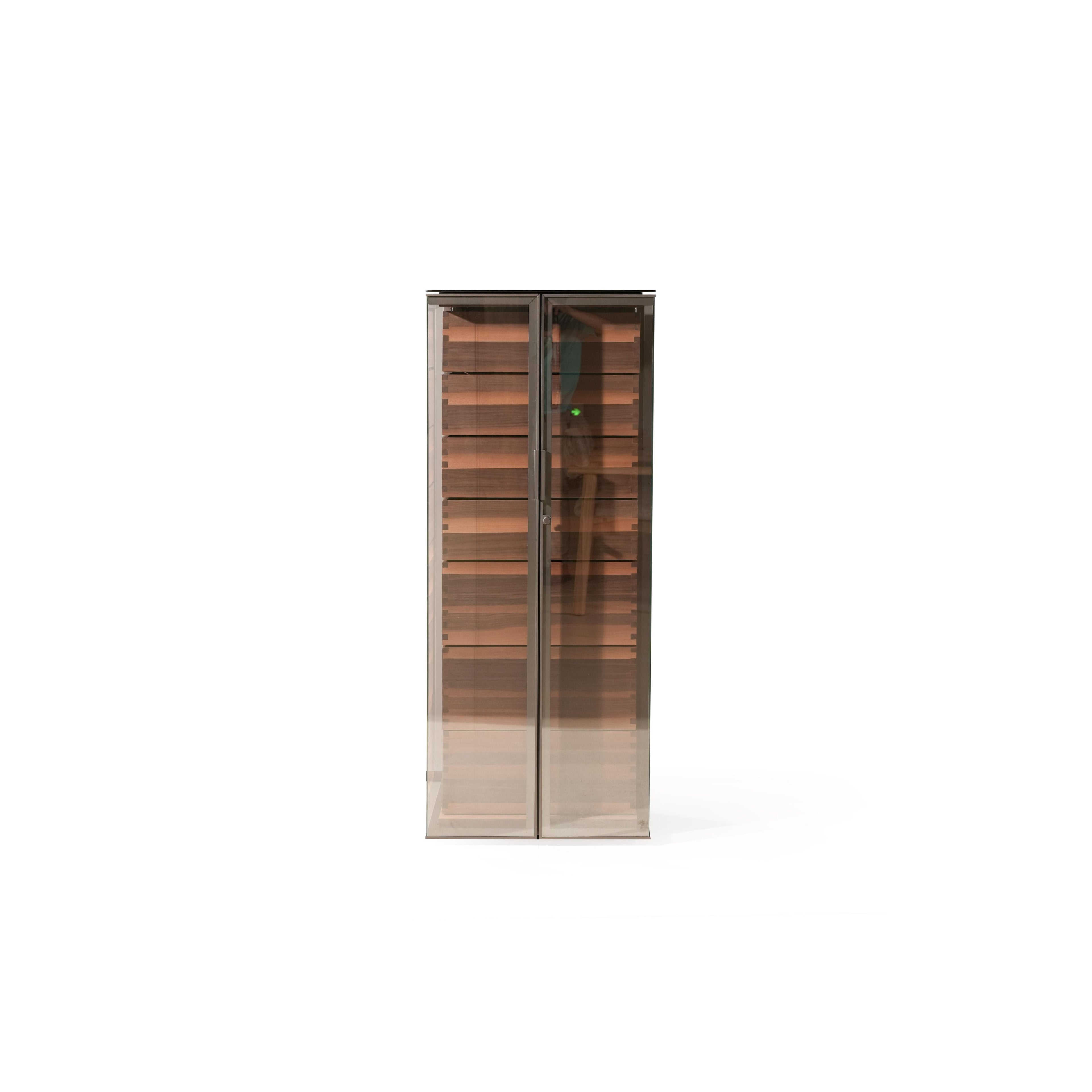Tall glass-door cabinet with dark wood shelves and metallic frame; rectangular form with two doors, visible horizontal shelves, and slim vertical handle; intended for storage or display; Category: Furniture > Storage > Cabinets