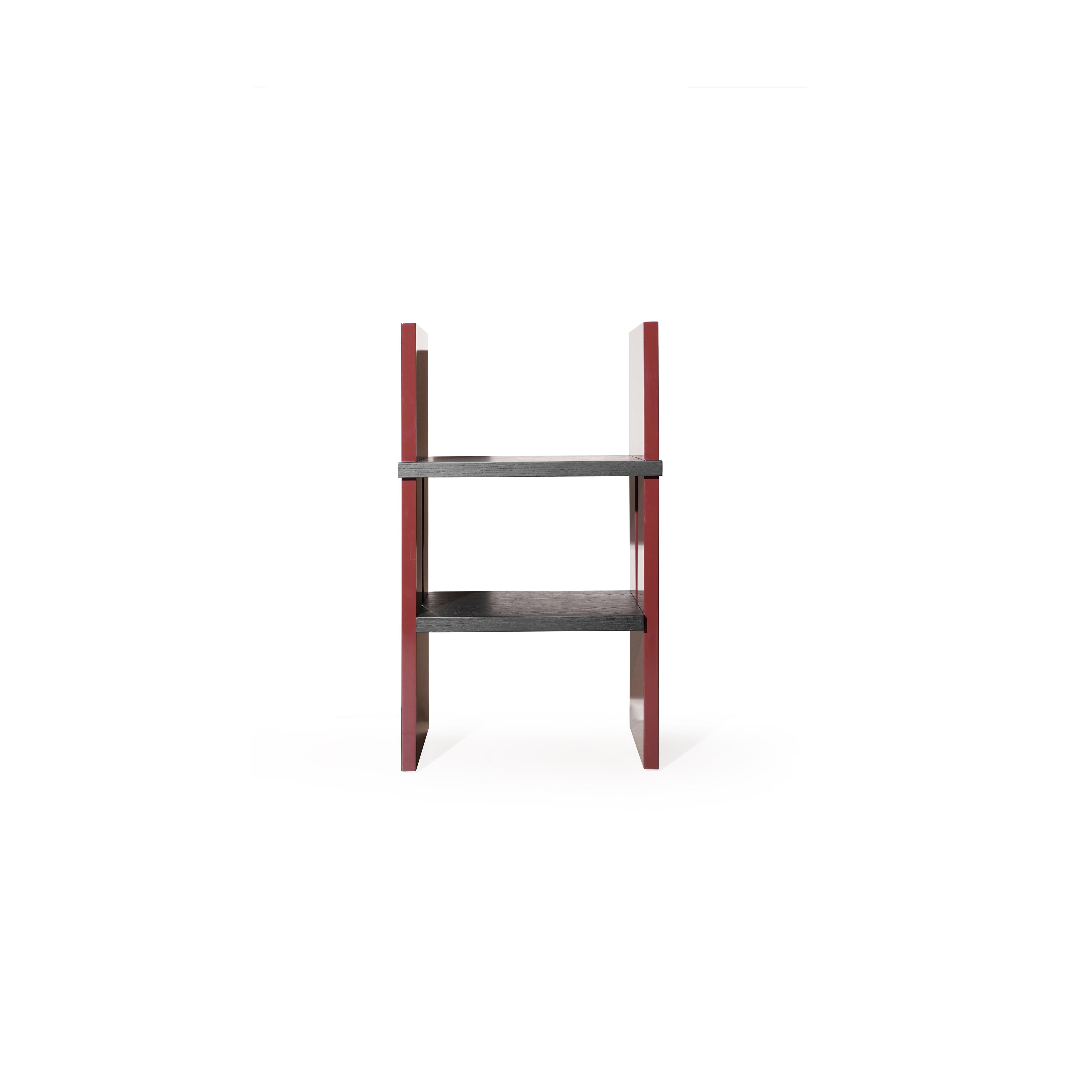 Two-tiered shelf unit with dark gray wooden shelves and glossy red vertical supports; rectangular form with no back or arms; intended for displaying items; Category: Furniture > Shelves > Display Shelves