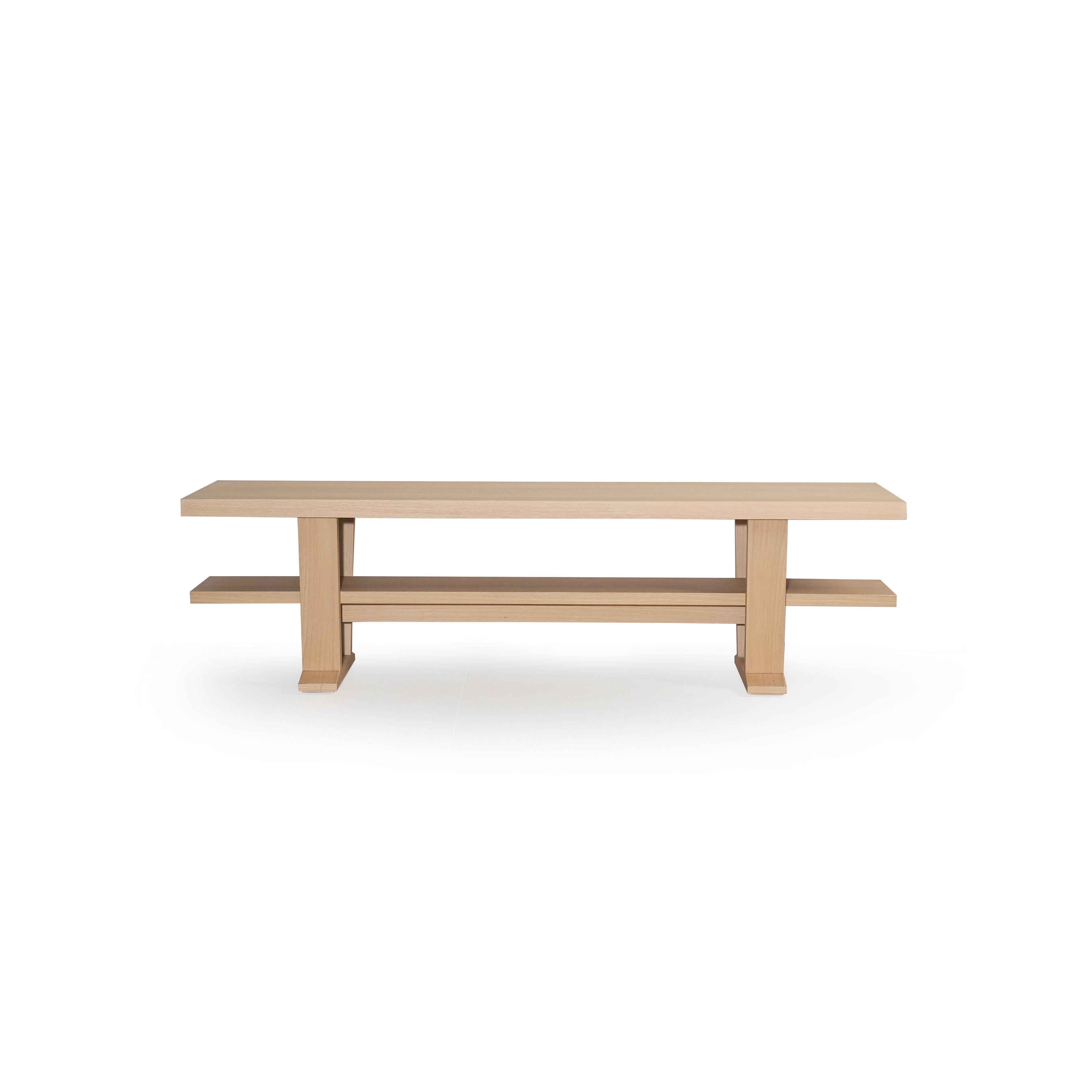 A wooden console table with a light-colored finish, featuring a rectangular top, two vertical legs, and a lower shelf supported by the same legs. The surface shows subtle wood grain. Intended for hallway or entryway use, it has a minimalist design with clean lines and no visible fasteners or handles. Category: furniture/console-tables