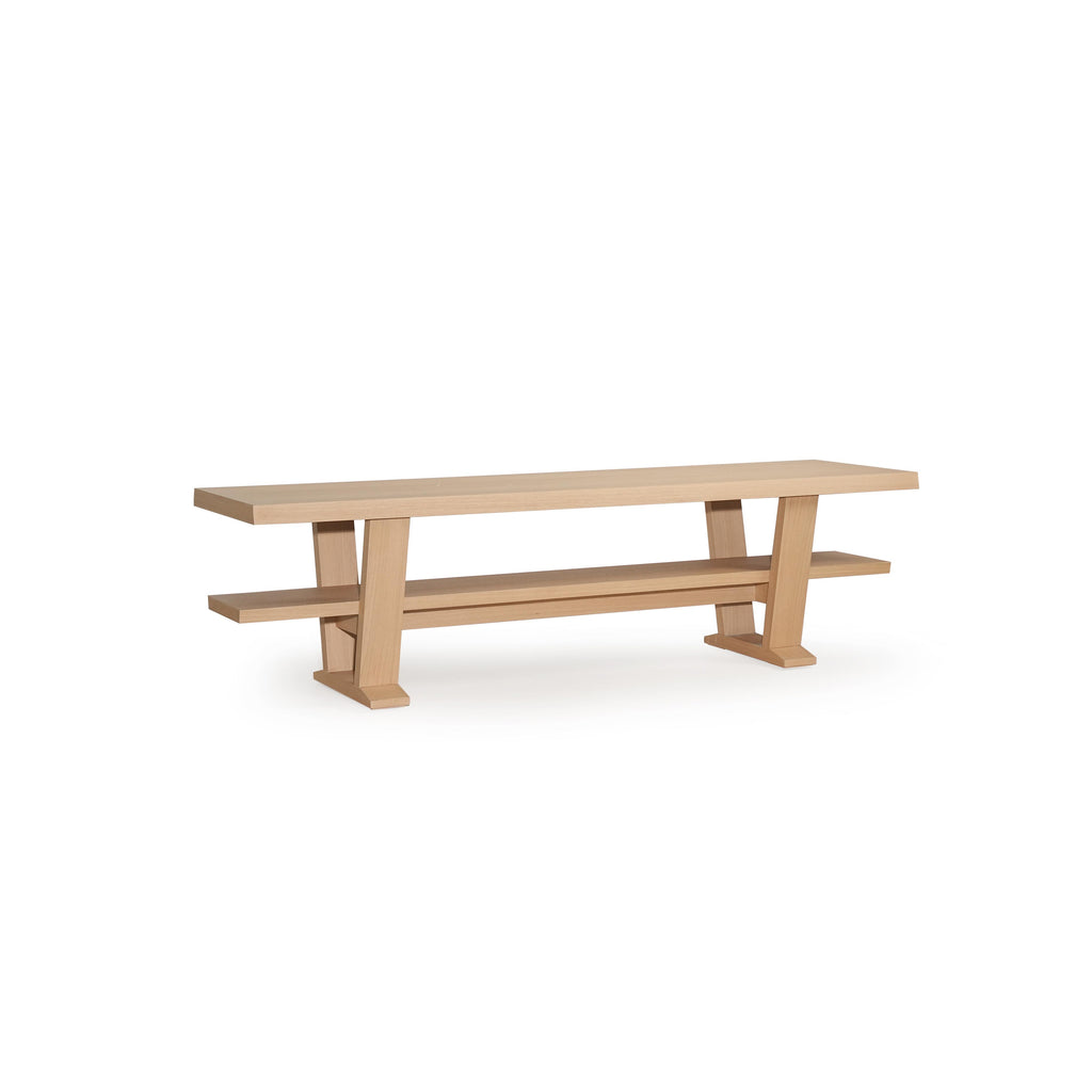 A wooden console table with a light-colored finish, featuring a rectangular top, two vertical legs, and a lower shelf supported by the same legs. The surface shows subtle wood grain. Intended for hallway or entryway use, it has a minimalist design with clean lines and no visible fasteners or handles. Category: furniture/console-tables