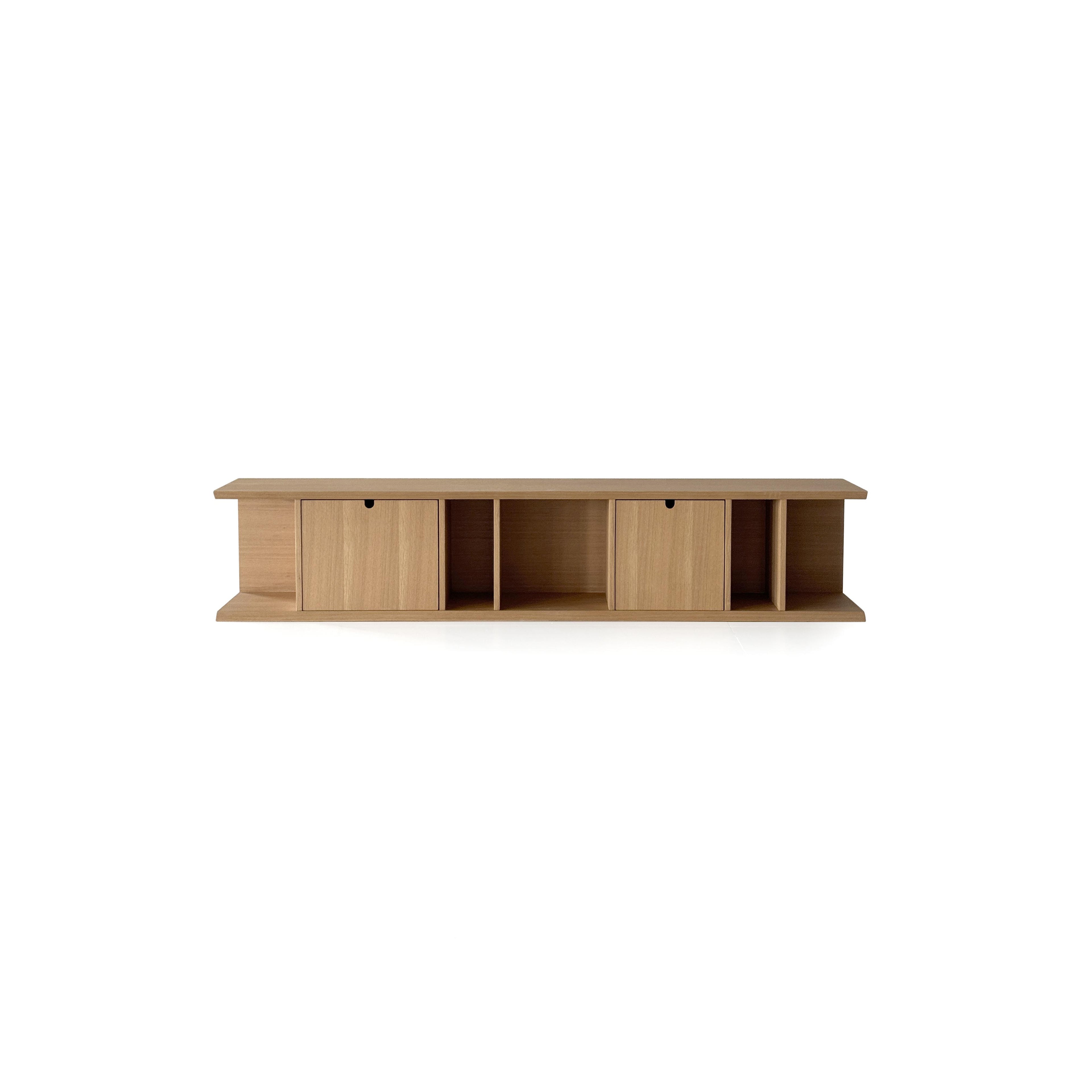 This is a long, low-profile wooden storage unit with two drawers and two open compartments. It features flat-panel doors with black pull handles, a flat top surface, and a lower shelf. Made of light-toned wood with visible grain, it’s designed for organizing items. Category: furniture > storage > shelves and cabinets