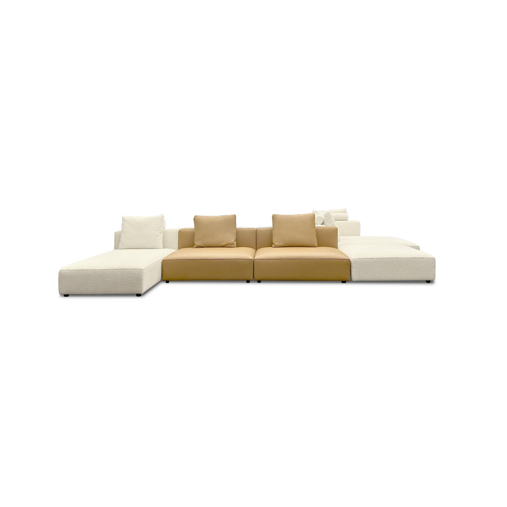 Modular sectional sofa with beige and tan fabric upholstery, featuring segmented seating, backrests, and armrests; includes plush cushions and low-profile legs; designed for lounging and casual seating; Category: furniture > sofas > sectional sofas