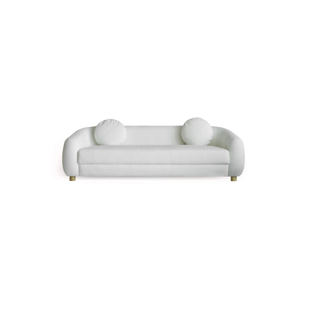 This is a three-seater sofa with rounded arms and a low back, upholstered in a beige, textured fabric. It rests on four small, rounded wooden legs. Designed for seating, it features a continuous cushioned seat and backrest with no visible stitching or fasteners. Category: Furniture > Sofas > Sectionals