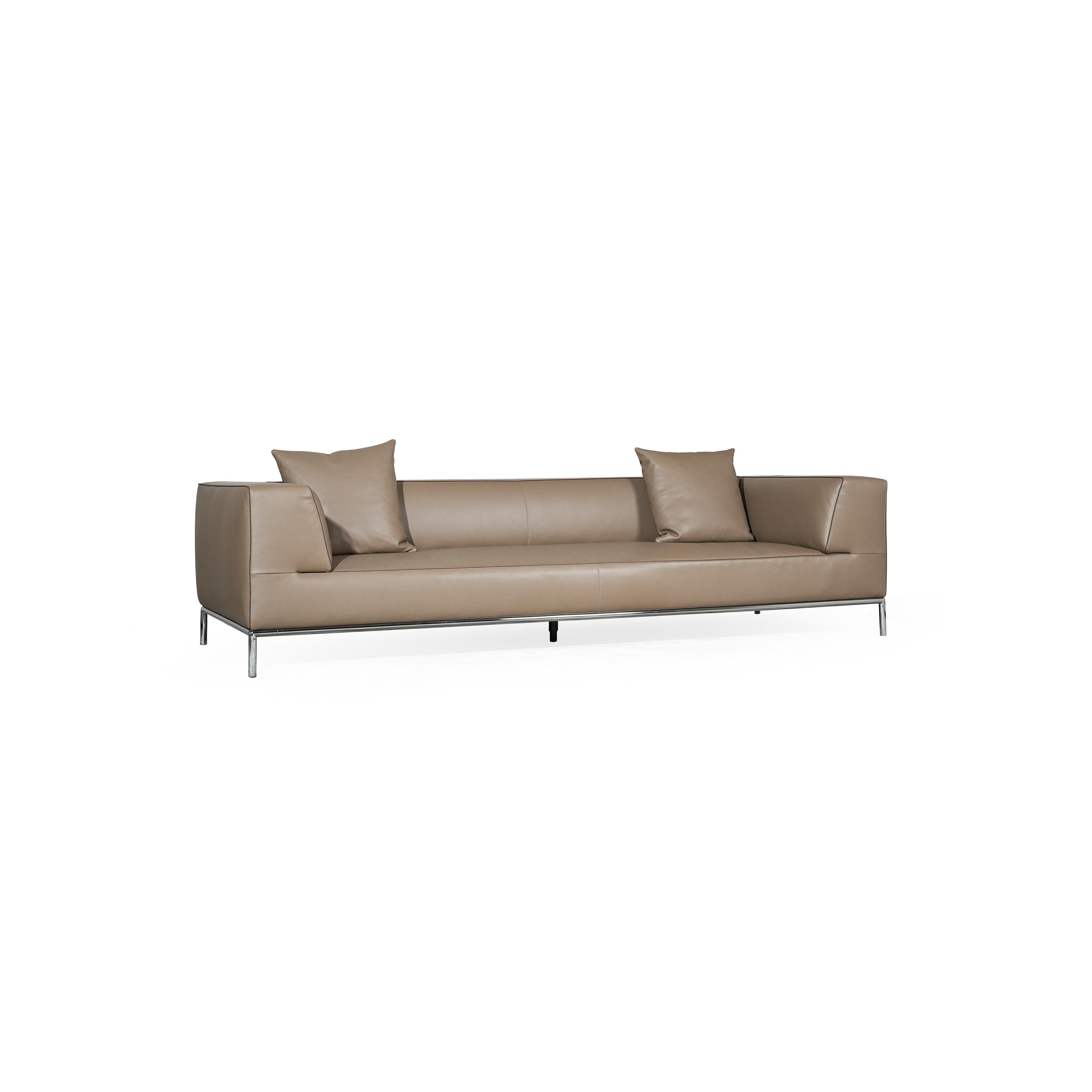 A three-seater sofa with a tan leather-like upholstery, featuring two matching square cushions, rectangular armrests, and a low-profile metal frame with four slender legs. Intended for seating, it has visible stitching along seams and a clean, minimalist silhouette. Category: furniture/southern-style-sofas