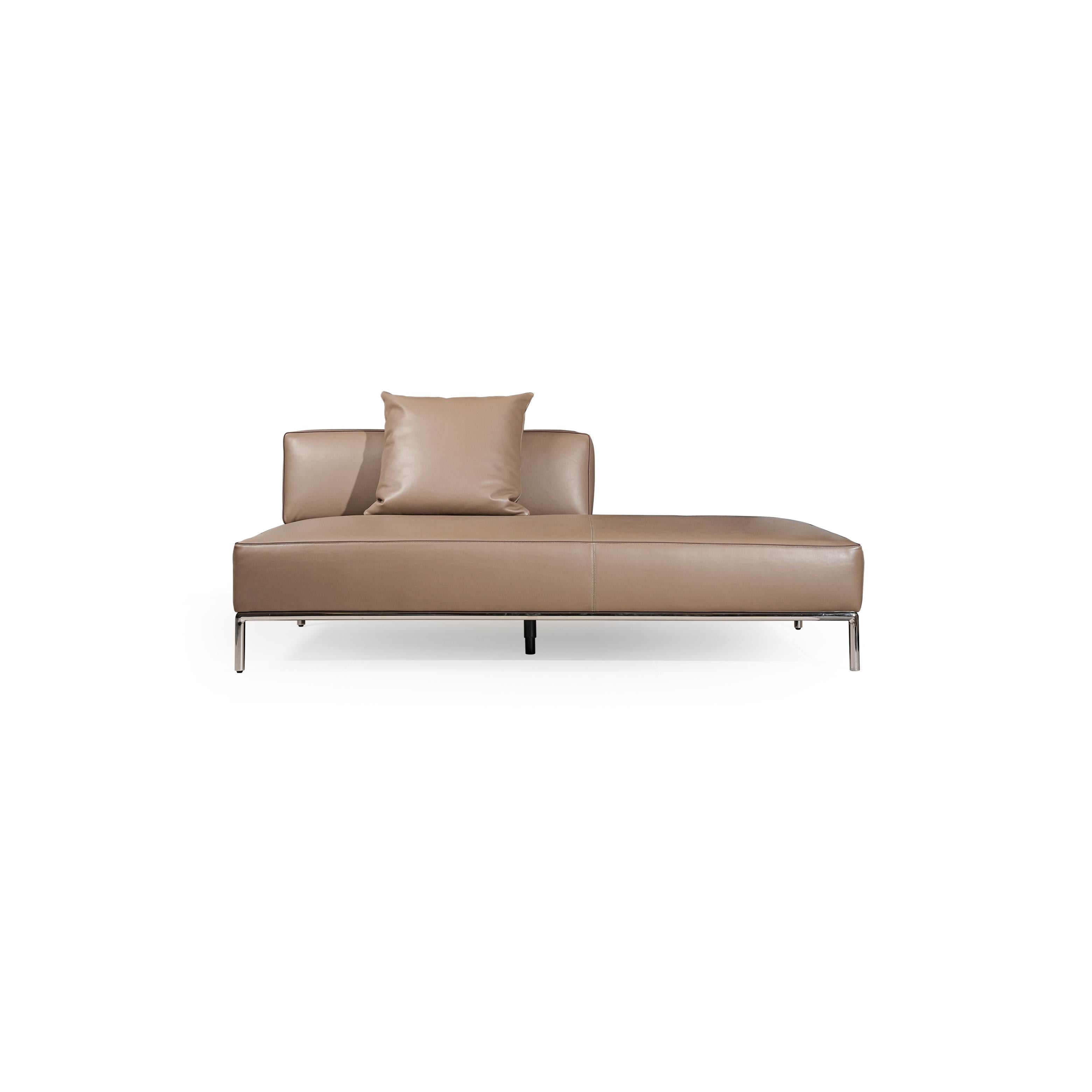 A three-seater sofa with a tan leather-like upholstery, featuring two matching square cushions, rectangular armrests, and a low-profile metal frame with four slender legs. Intended for seating, it has visible stitching along seams and a clean, minimalist silhouette. Category: furniture/southern-style-sofas