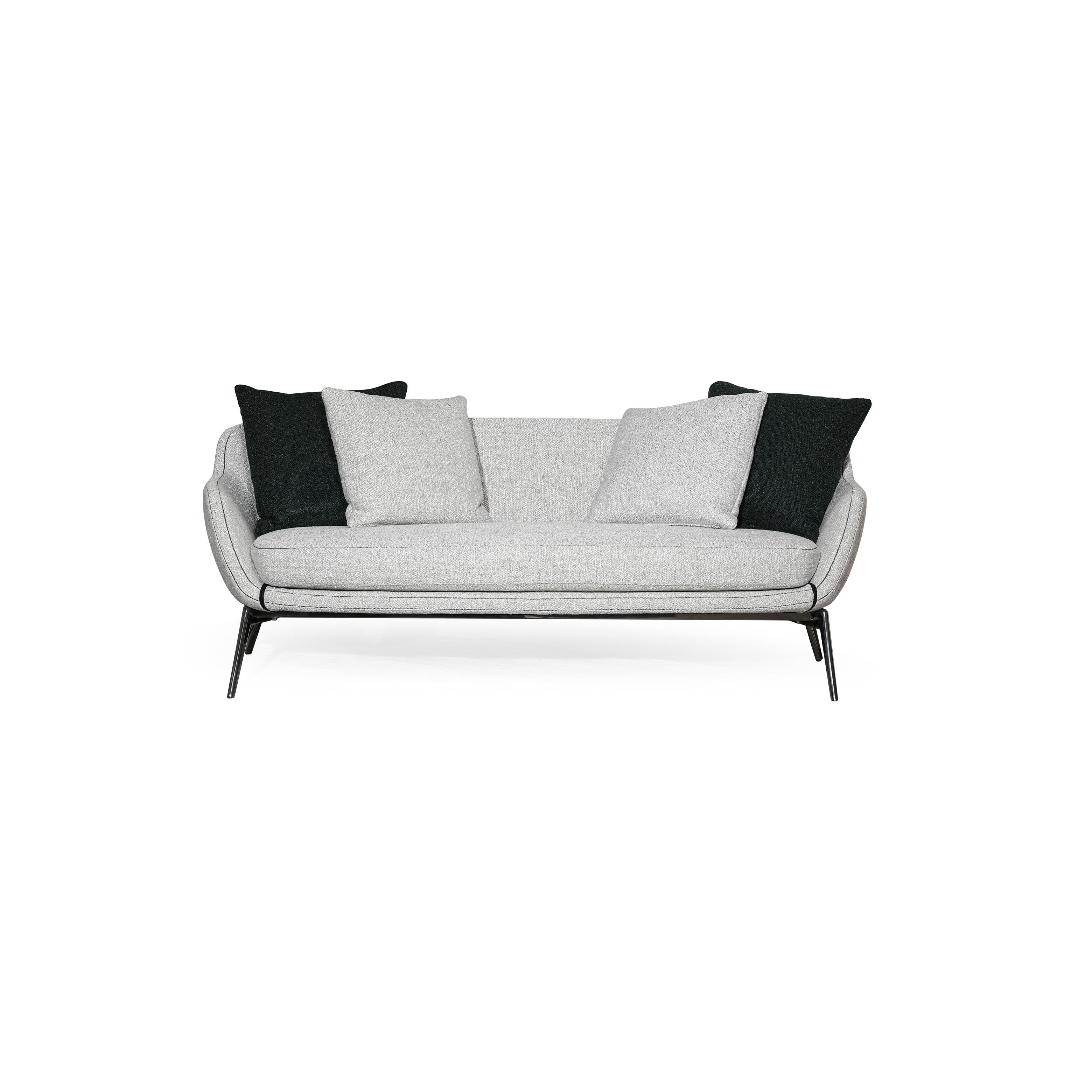 A two-seater sofa with light gray fabric upholstery and black accent pillows, featuring curved armrests, a low-profile backrest, and thin black metal legs. The seat and back cushions are visibly padded with matching fabric. Category: furniture/soups/sofas