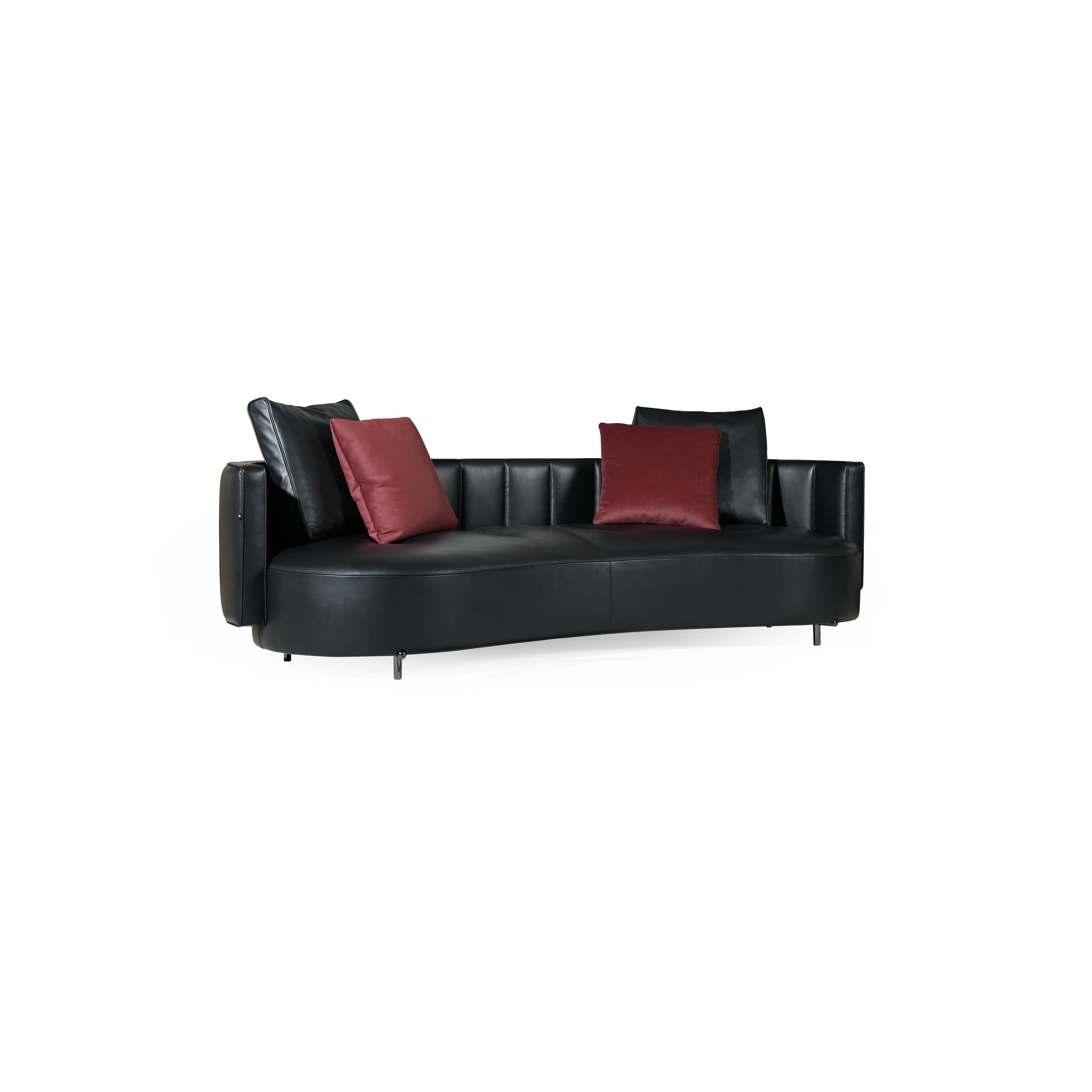 Black leather-like sofa with curved seat and back, featuring two red velvet cushions and two black back cushions; supported by four thin metal legs; designed for seating; Category: Furniture > Sofas > Sectionals
