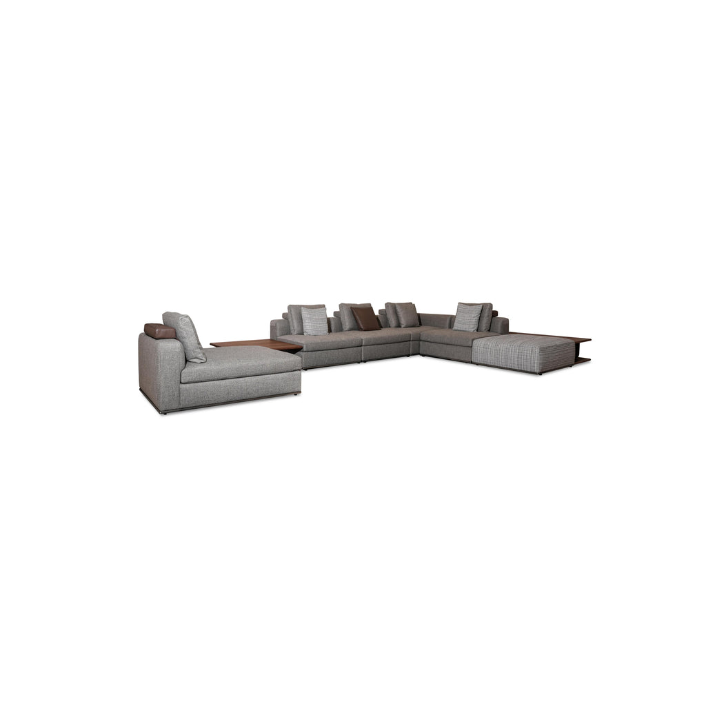 Modular sectional sofa with gray fabric upholstery, dark wood coffee table, and matching side tables; includes multiple cushions, low-profile legs, and visible stitching; designed for seating and lounging; Category: furniture > sofas > sectional sofas
