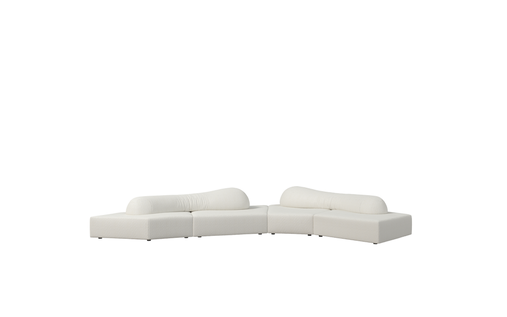Modular sectional sofa with off-white fabric upholstery, featuring two L-shaped segments connected by a central joint. Each segment has a rounded backrest and low-profile base with small dark feet. Cushions are plush and slightly contoured. Intended for seating in living areas. Category: furniture/sofas/modular