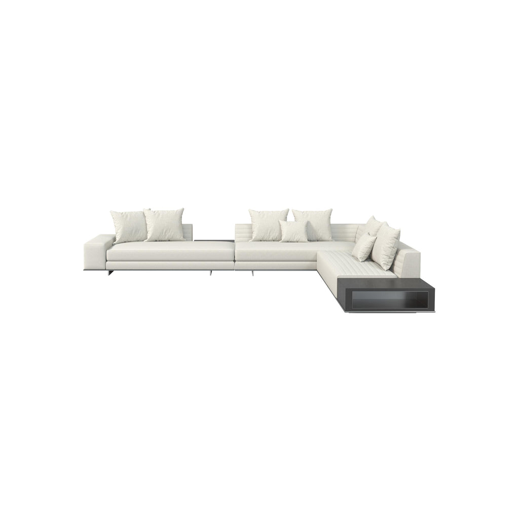 Modern sectional sofa with off-white fabric upholstery and dark gray base unit, featuring multiple cushions, low-profile legs, and a corner chaise with integrated shelf; designed for seating and casual lounging. Category: furniture/sofas