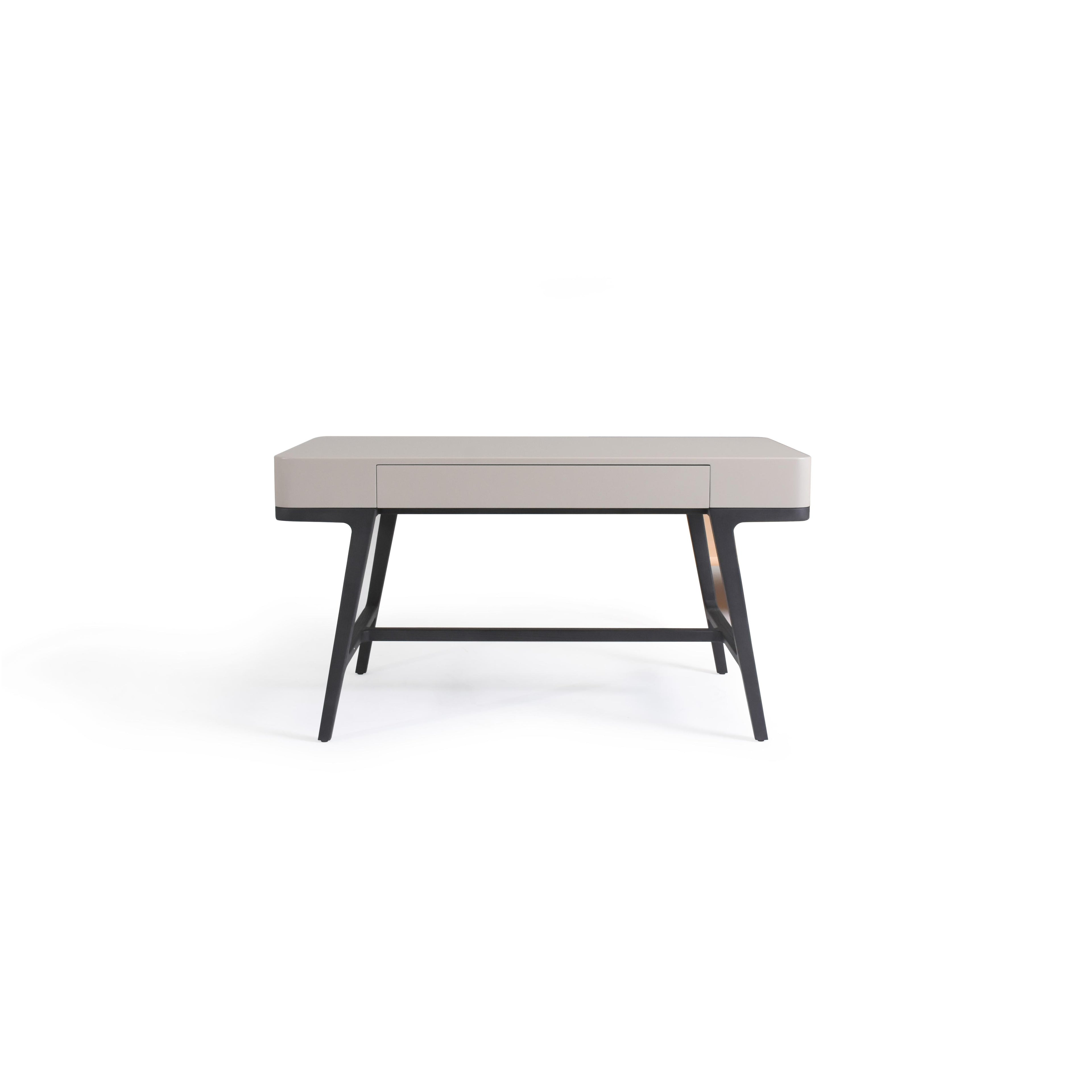 Modern desk with a light gray top and black legs, featuring a single drawer with a recessed handle, angled legs connected by a horizontal support bar, designed for work or study use; Category: furniture/desks