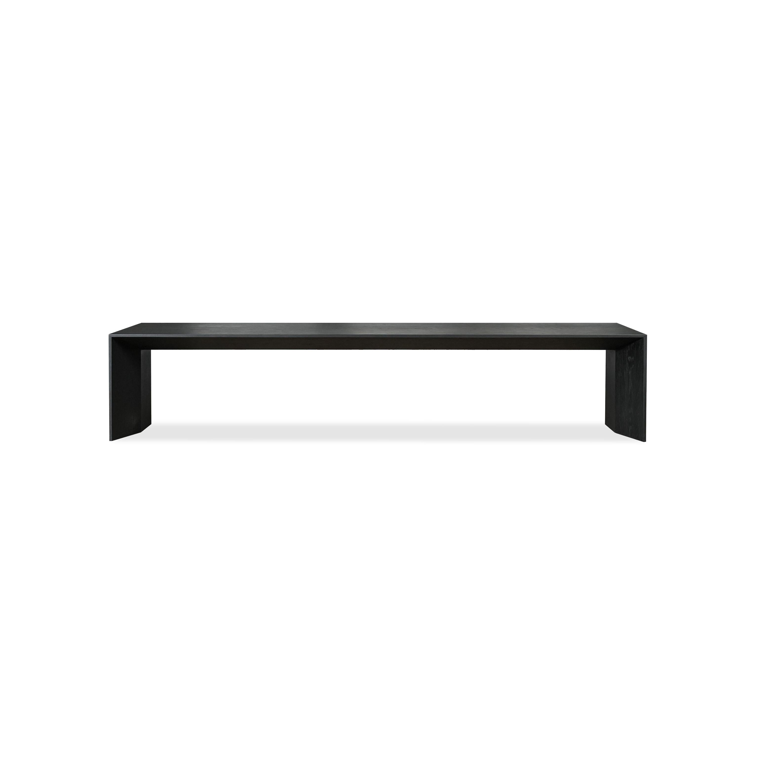 Modern console table with dark matte finish, rectangular top supported by two thick, angled legs. Minimalist design with no visible hardware or embellishments. Intended for hallway or entryway use. Category: furniture/console-tables
