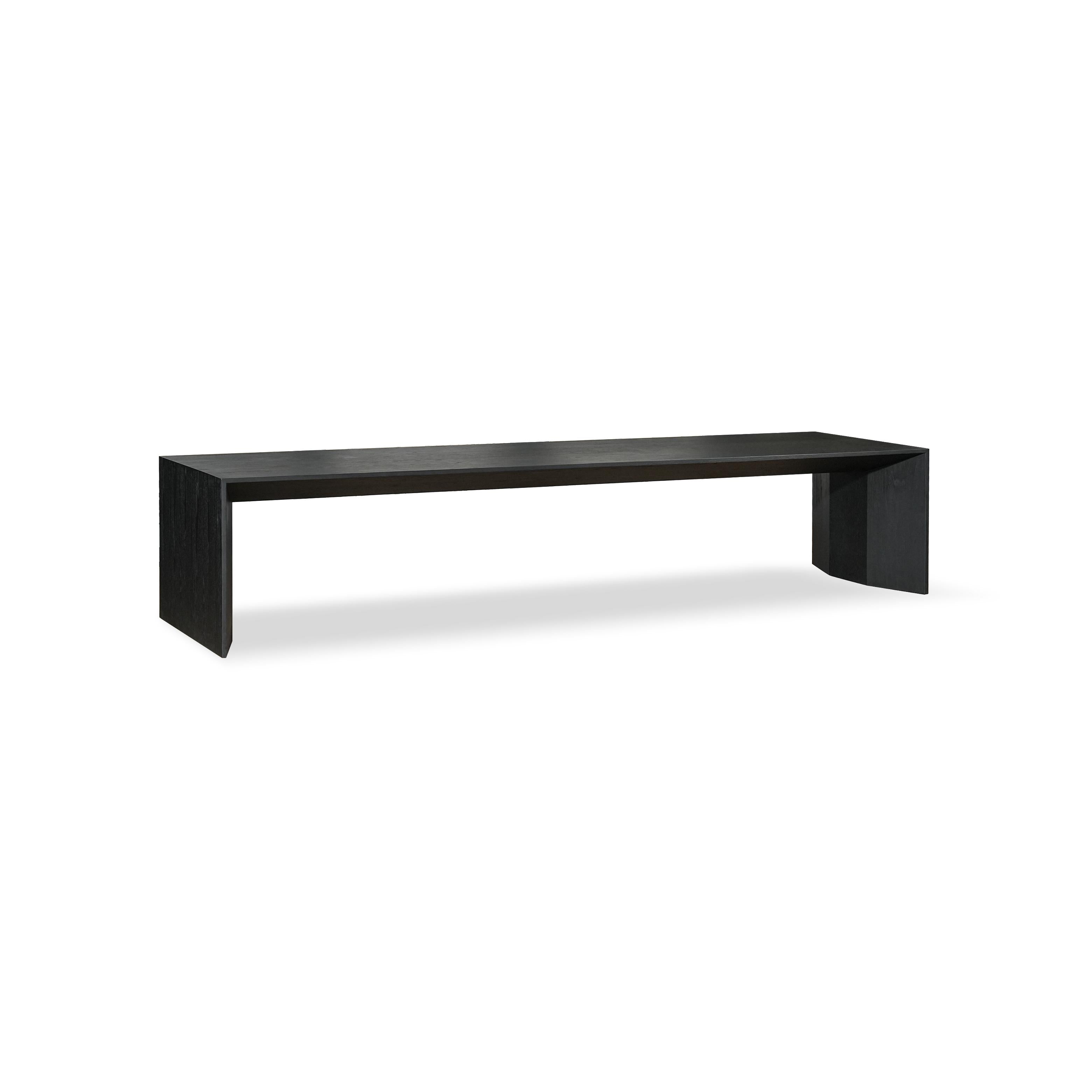 Modern console table with dark matte finish, rectangular top supported by two thick, angled legs. Minimalist design with no visible hardware or embellishments. Intended for hallway or entryway use. Category: furniture/console-tables